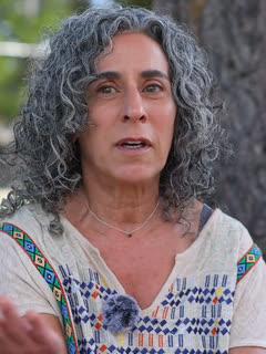 Vicky Dorvee, beside a cottonwood.